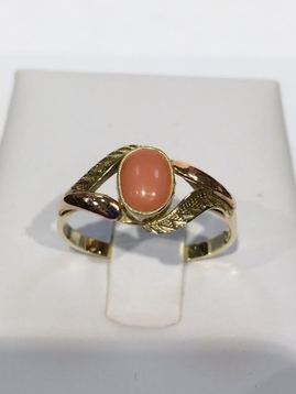 Golden ring with coral